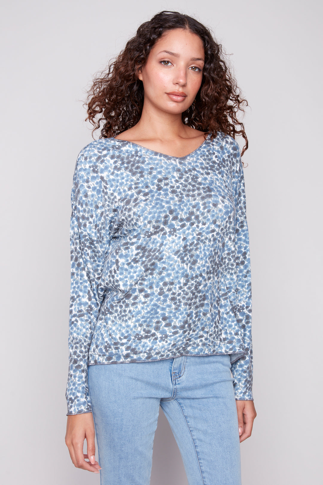 Charlie B Fall 2025 
It features a flattering soft cut v-neck and a neat tie-dye print. Wear it with jeans or capris for an elevated casual look.