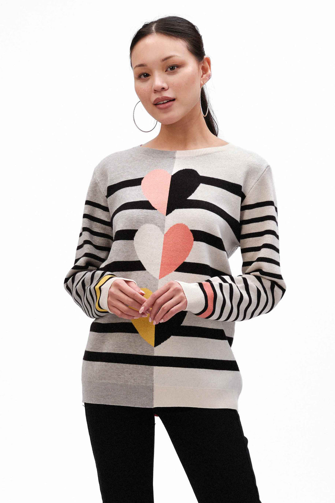 Fashion Concepts Fall 2024 Beautiful warm hearts on the front makes this a special piece! Fine-gauge knit yarn on body provides softness and the stripes on the sleeves and body provide contrast and style.