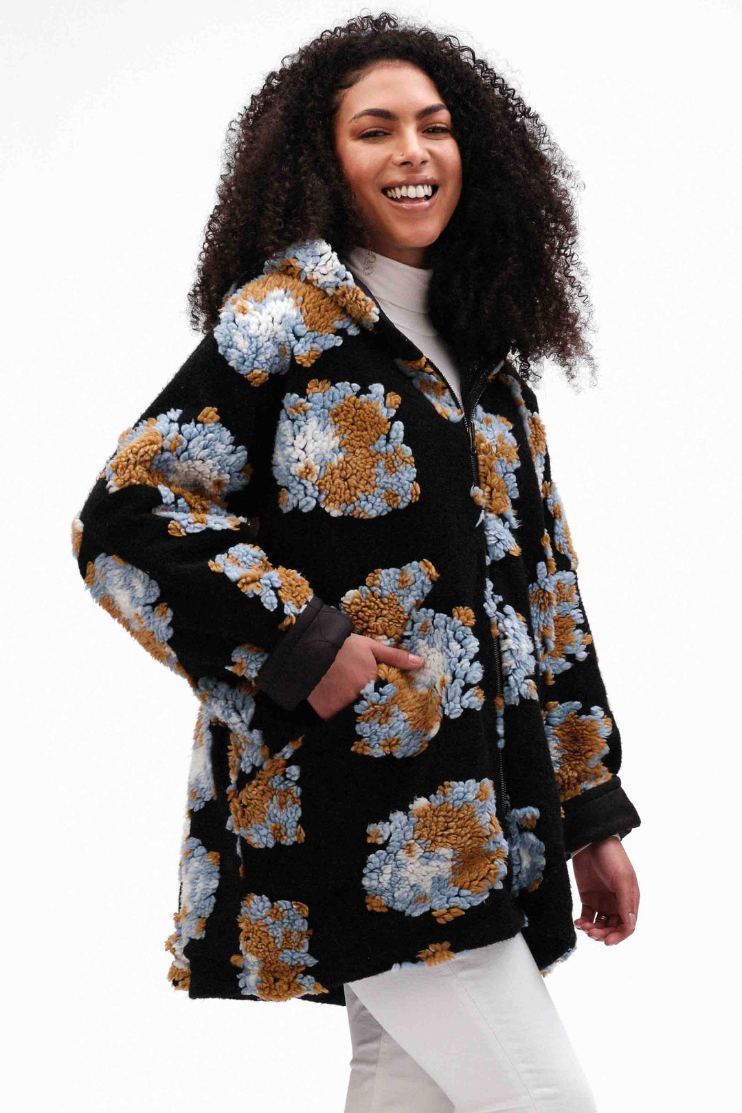 Fashion Concepts Fall 2024  With its two-way wear and reversible design, this jacket offers versatility and style. Stay warm with its quilted side, while its floral knit pattern adds a touch of flair. 