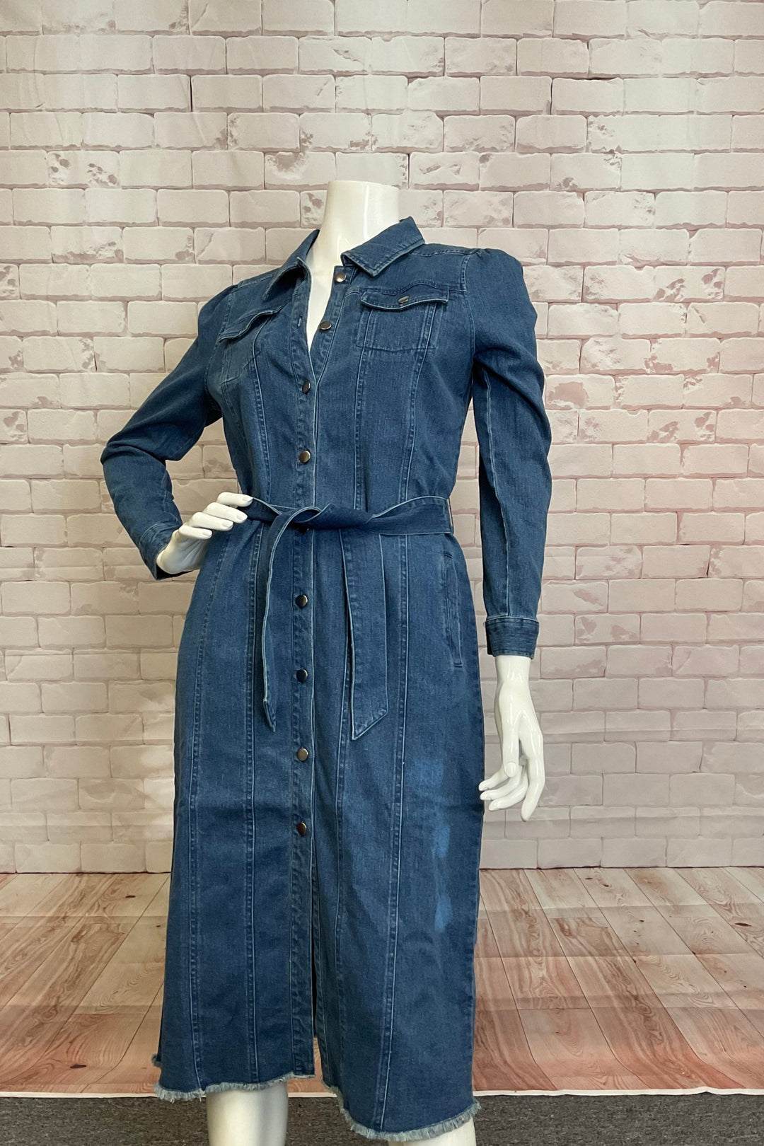 FDJ Fall 2024  The classic spread collar, flattering fit, and tie belt make it the perfect casual and cool addition to any wardrobe. Plus, the distressed hem design and front buttons add a touch of trendy flair. 