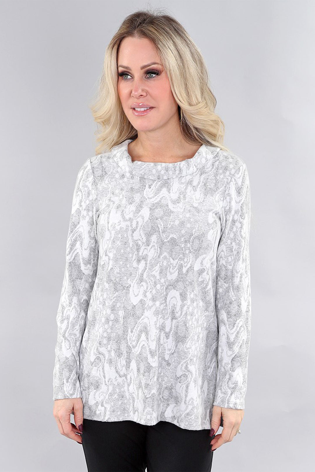 MICHAEL TYLER Fall 2025 
Crafted from soft sweater knit fabric, its loose fit and light cowl neck offer comfort and effortless style for cooler days. Perfect for layering or wearing on its own, this tunic combines cozy warmth with contemporary design.