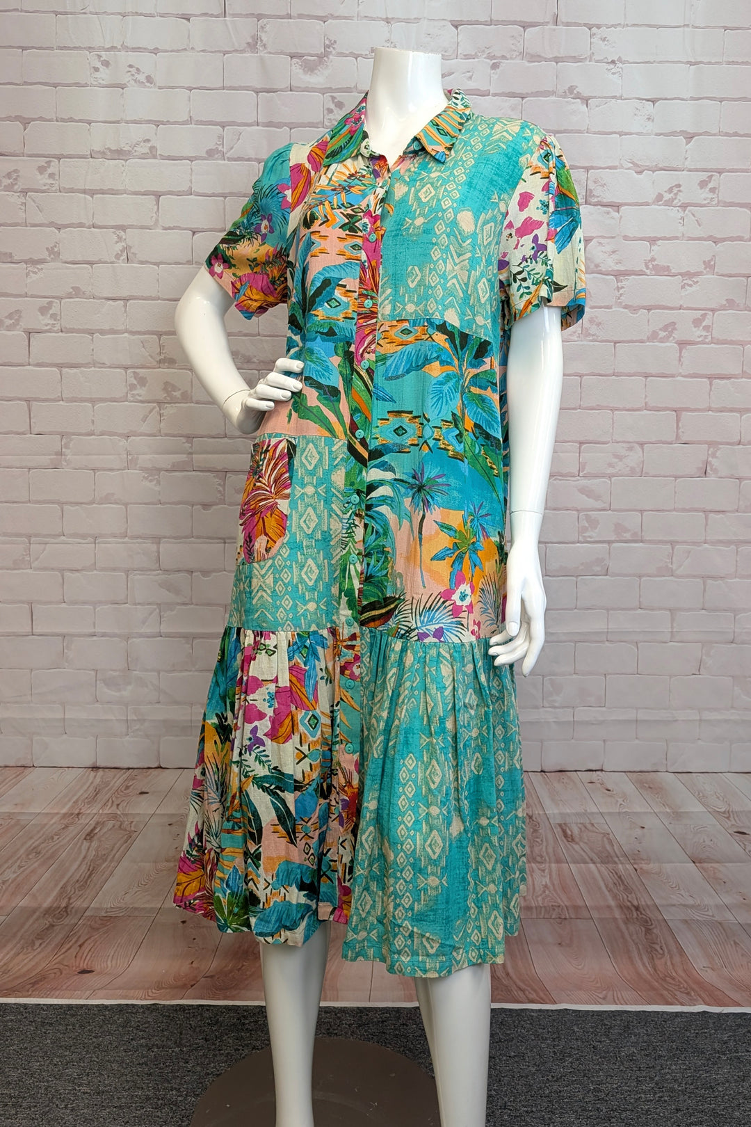 ORIENTIQUE Spring 2025 The tiered design gives a unique touch to this midi length dress, while the cotton and linen blend keeps it light and loose.