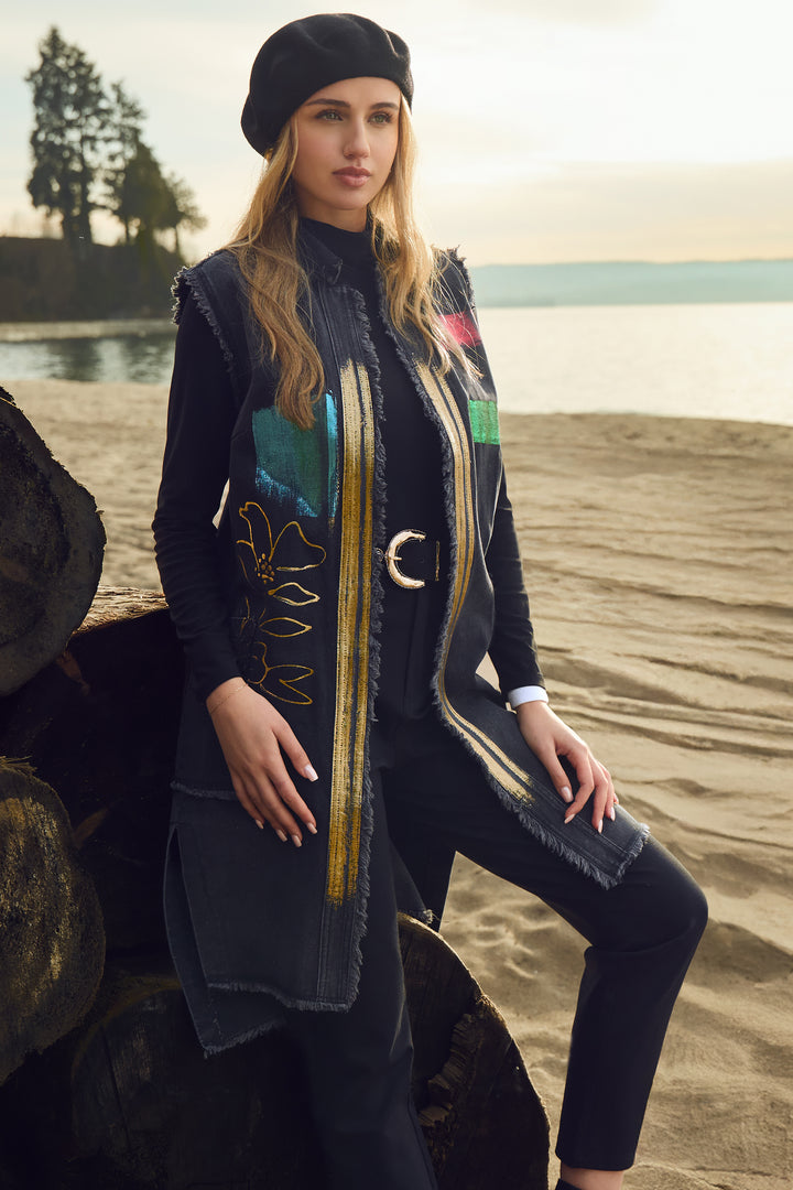 Frank Lyman Fall 2025 Adorned with floral and paint patch patterns, it creates a unique artistic flair. Falling just at mid-thigh, it offers an elongated silhouette that enhances any outfit with a sophisticated touch.