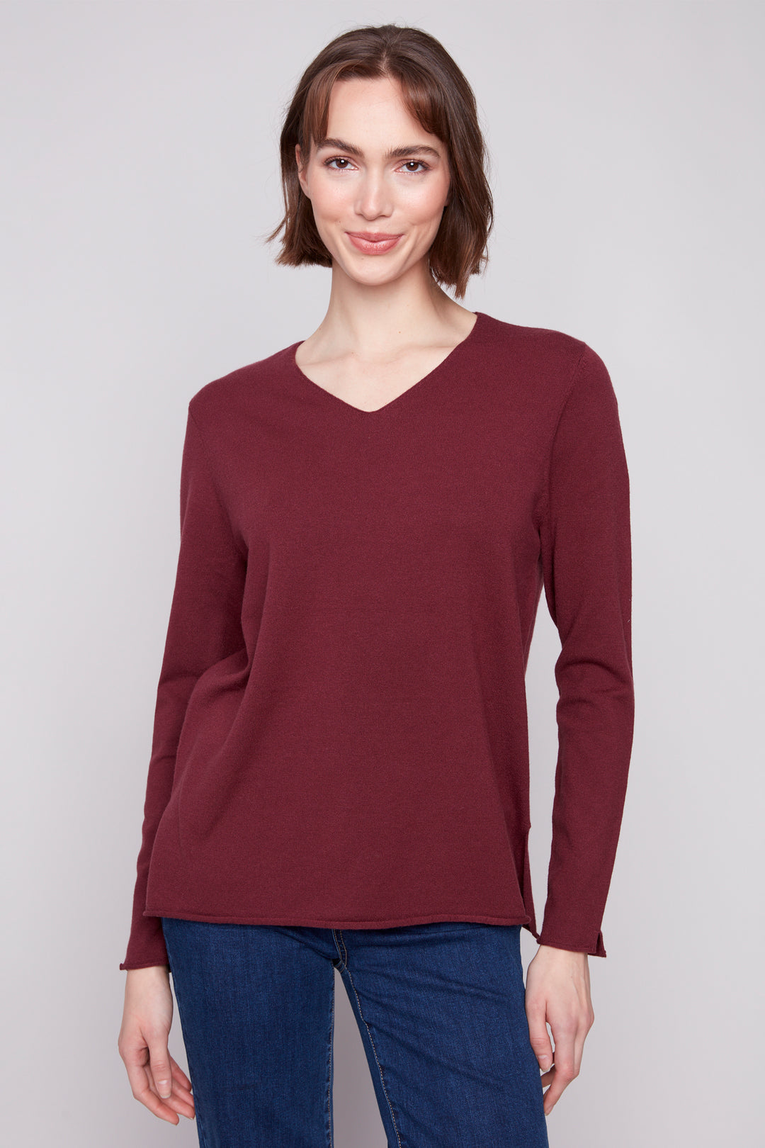 Charlie B Fall 2025 
With its soft cut v-neck and light sweater material, this solid colour sweater top is great for the office or days out. 