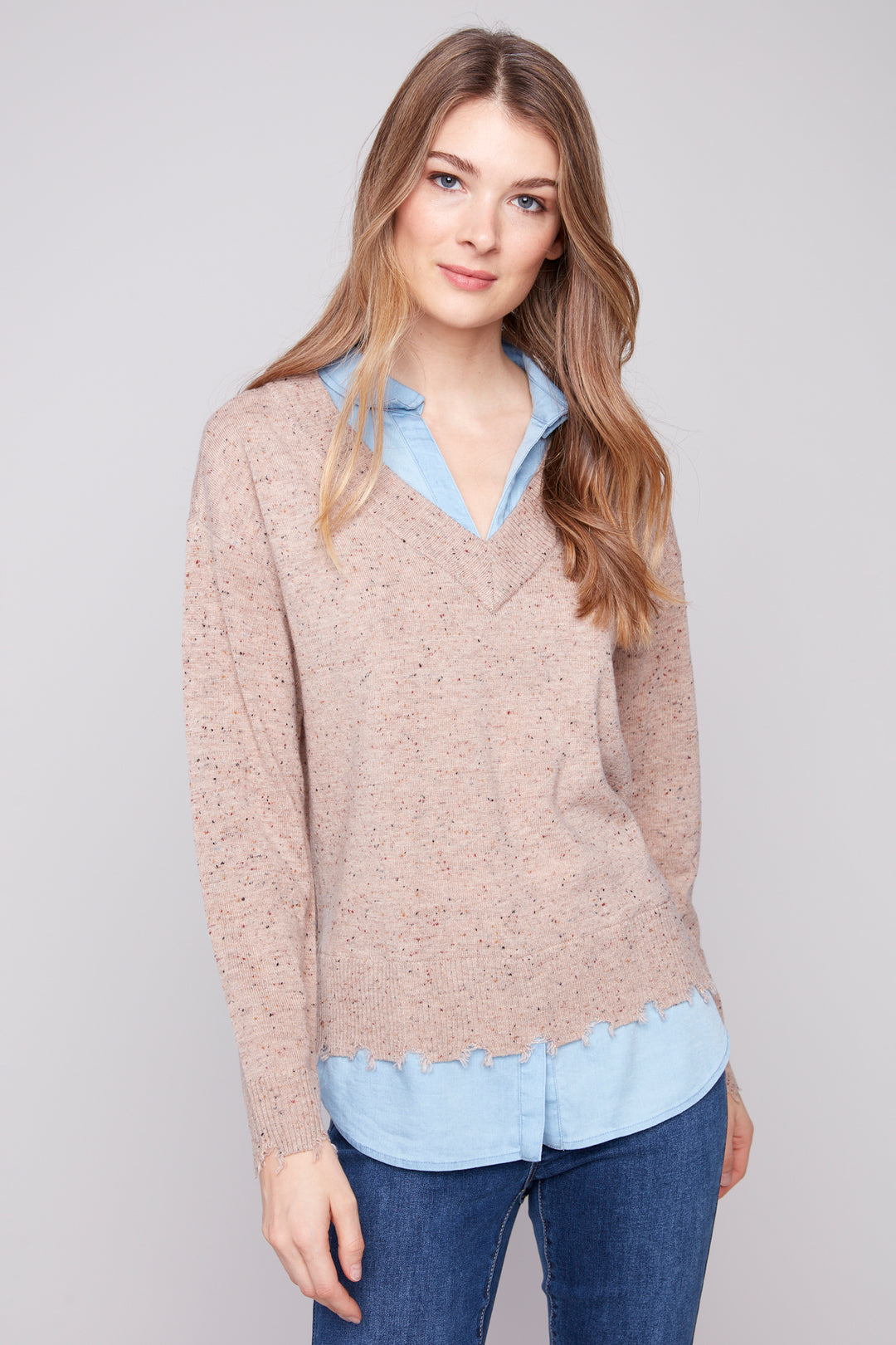 Charlie B Fall 2025 
 Discover endless styling possibilities with the Fooler Sweater With Shirt Collar. Its 2-in-1 design effortlessly creates a layered look, while the frayed edge hem adds a touch of edginess. 