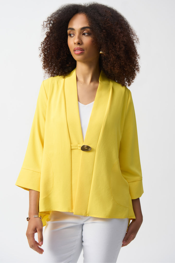 Joseph Ribkoff Spring 2025  The single button closure and cuffed 3/4 length sleeves provide a professional yet comfortable fit. 