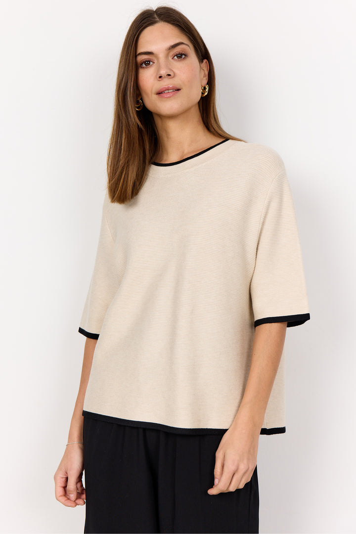 Soya Concept Fall 2025 
 The textured ribbed design adds subtle sophistication, making it a versatile piece that effortlessly combines simplicity with a refined look. 