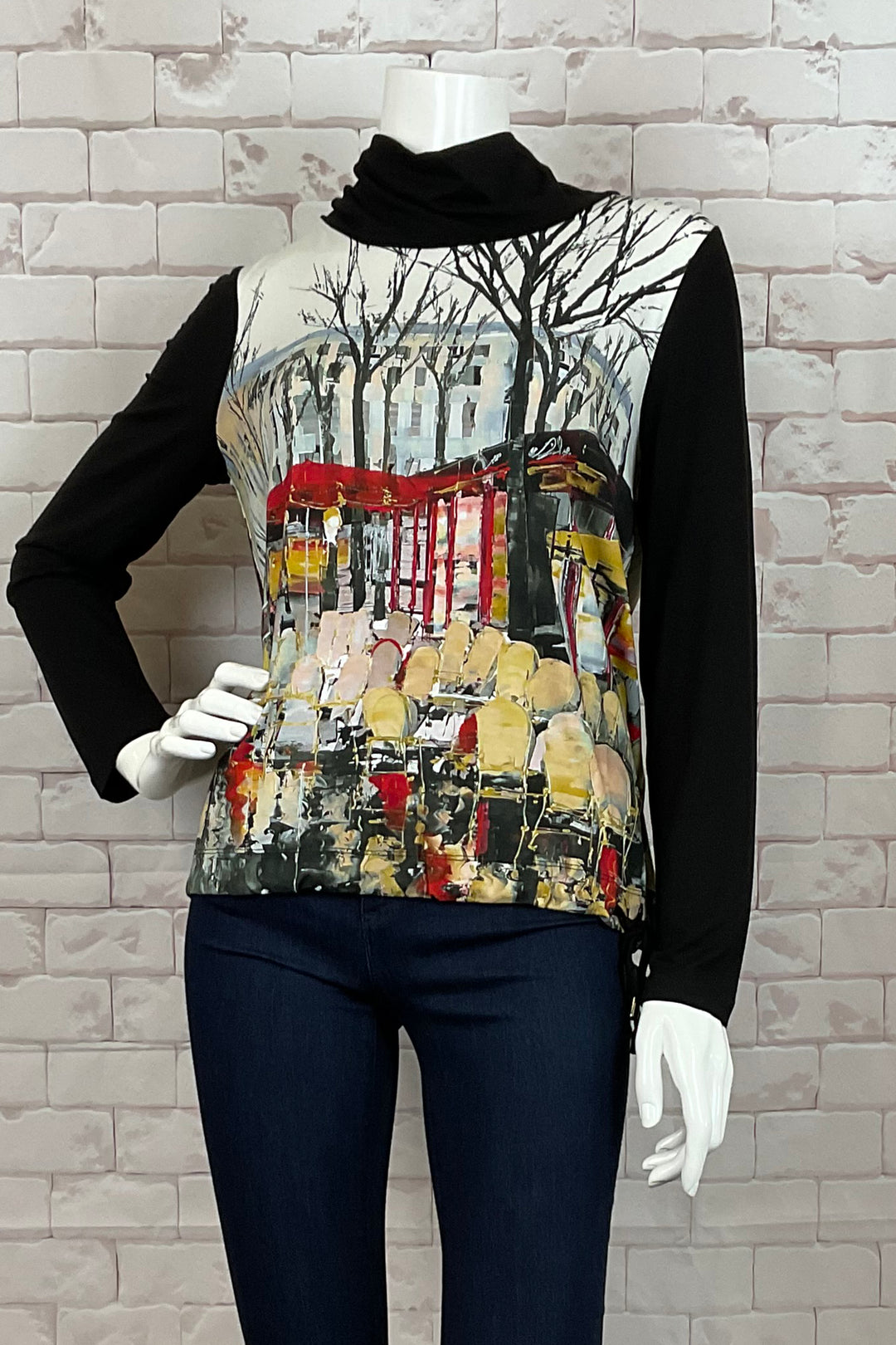 Dolcezza Fall 2024  This top features a neat autumn day in Pairs art print. The top has full length length contrast black sleeves, cowl neckline, side drawstring hem and a classic straight cut that is flattering on all shapes and sizes.