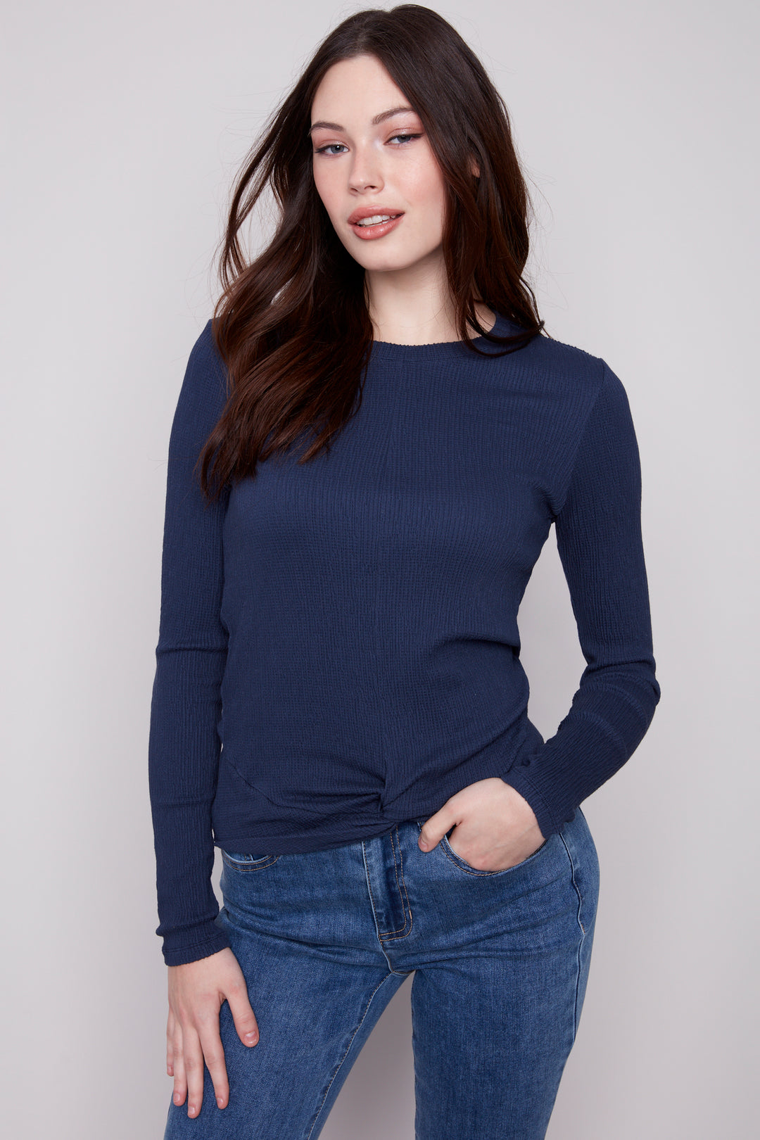 Charlie B Fall 2025 
This textured long-sleeve top features a stylish front tie knot and a classic crew neck, offering a light and comfortable fit. 