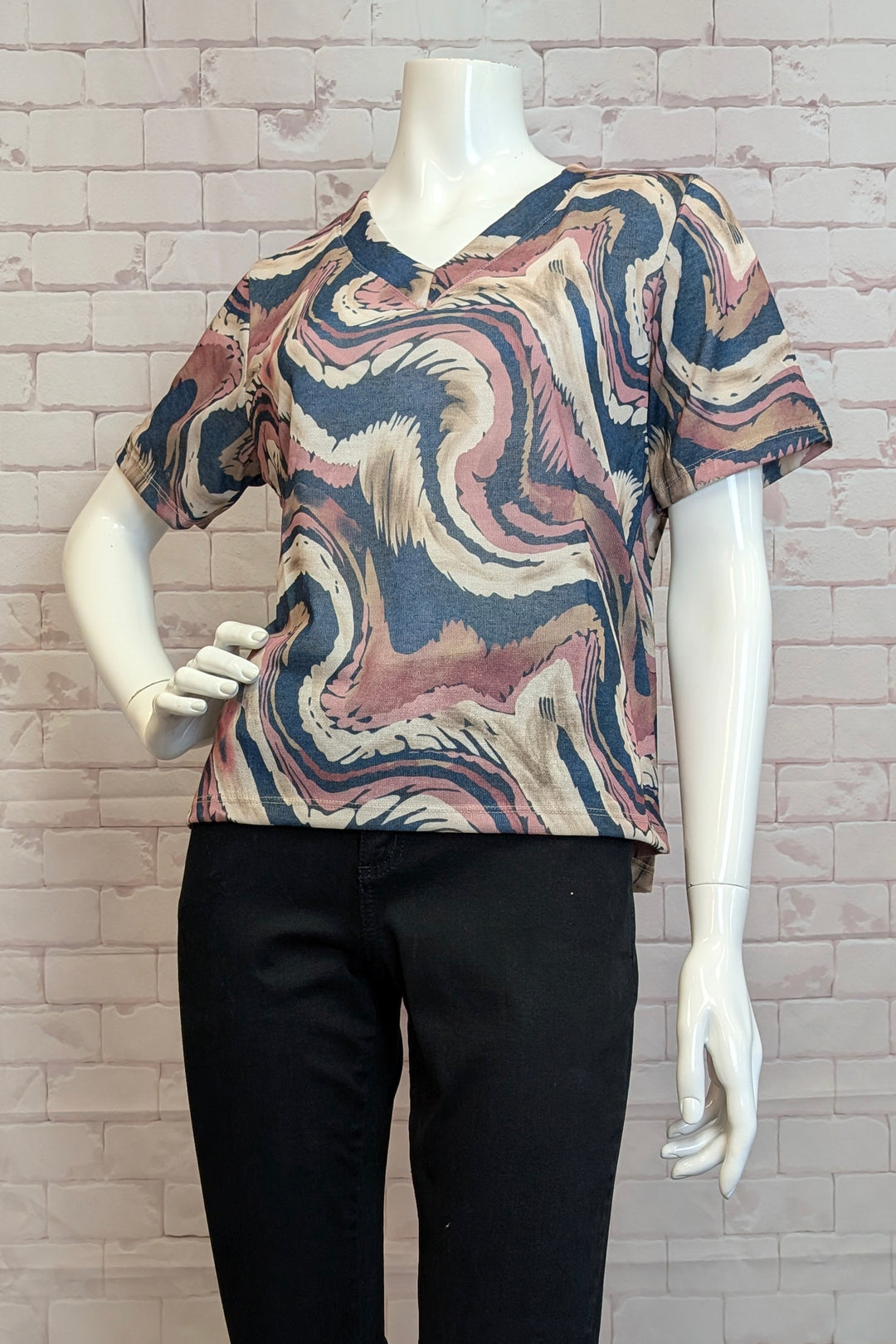 M Italy Fall 2025 
This printed short-sleeve V-neck top features a neat waves pattern and a double-stitched hem &amp; cuffs for durability. The carefully stitched V-neck adds a refined touch, making it an ideal choice for pairing with capris or jeans. 